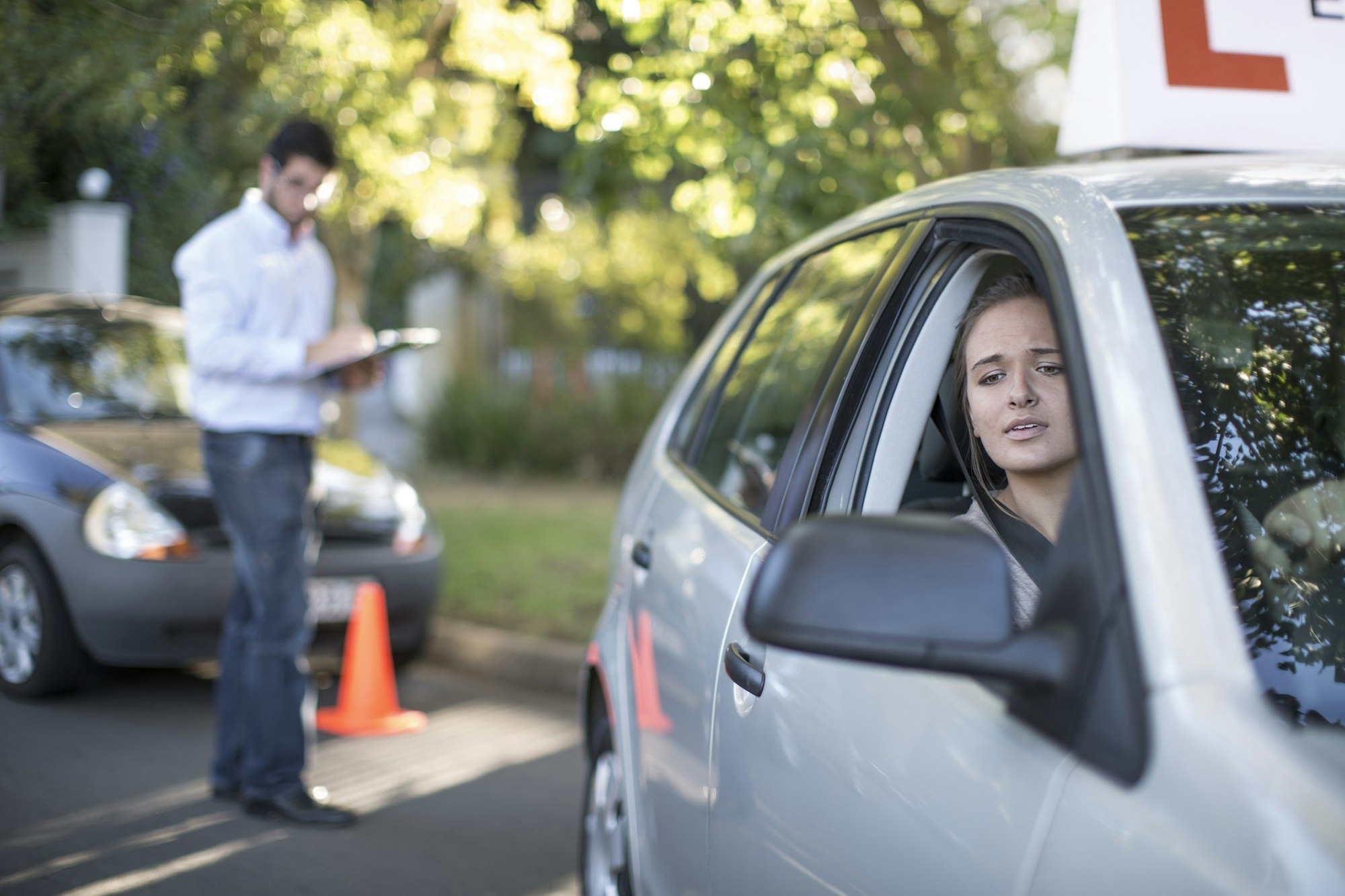 Teenage girl during driving license test